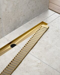 Изображение товара Дренажный канал Timo Drain System DS230107/17, 70 см, с перфорированной решеткой lines, цвет золото матовое